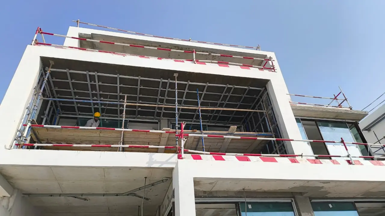 Exterior HPL ceiling support framing across a balcony elevation